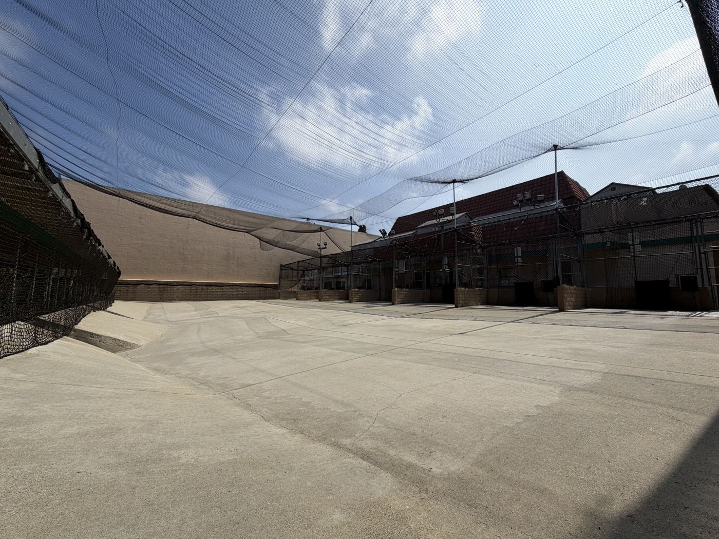 Wide-open outdoor hitting area under the 30-foot nets